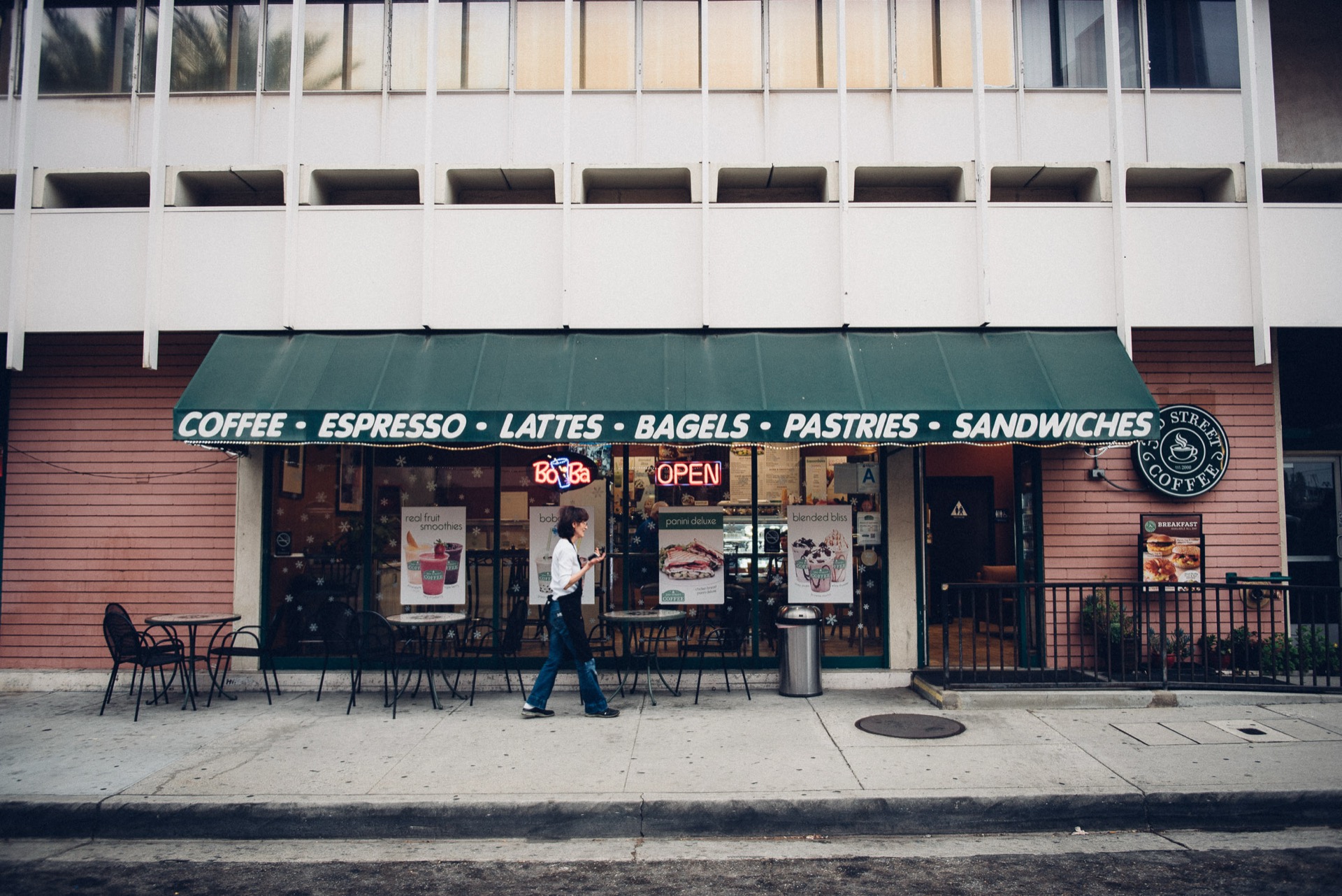 3rd Street Coffee storefront in Downey, CA with green awning and outdoor seating